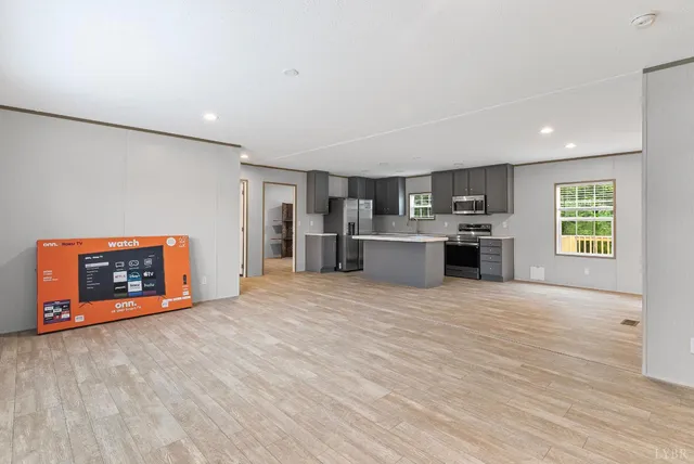 a view of a kitchen with a stove cabinets and wooden floor