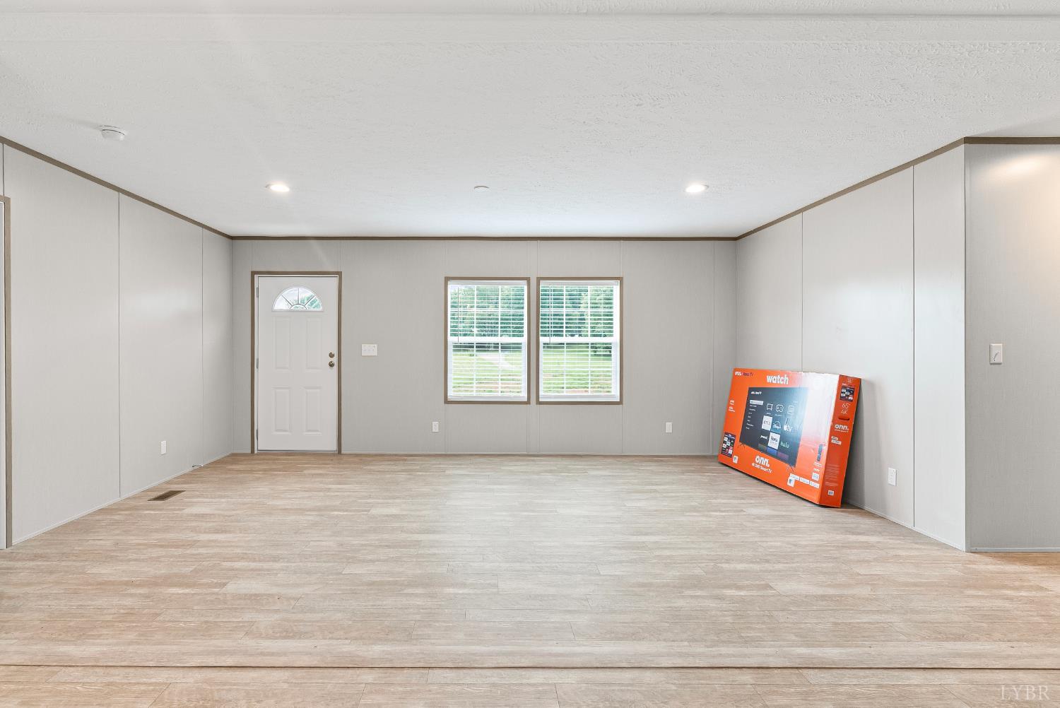 4526 Pigeon Run Road Gladys, VA 24554 - Photo 4 of 54 a view of an empty room with wooden floor and a window