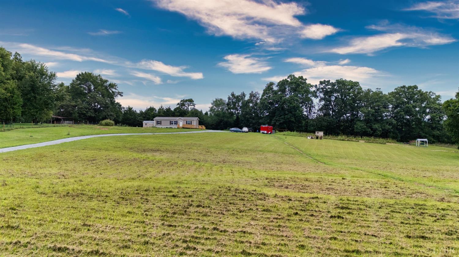 4526 Pigeon Run Road Gladys, VA 24554 - Photo 47 of 54 a view of a big yard with plants and large trees