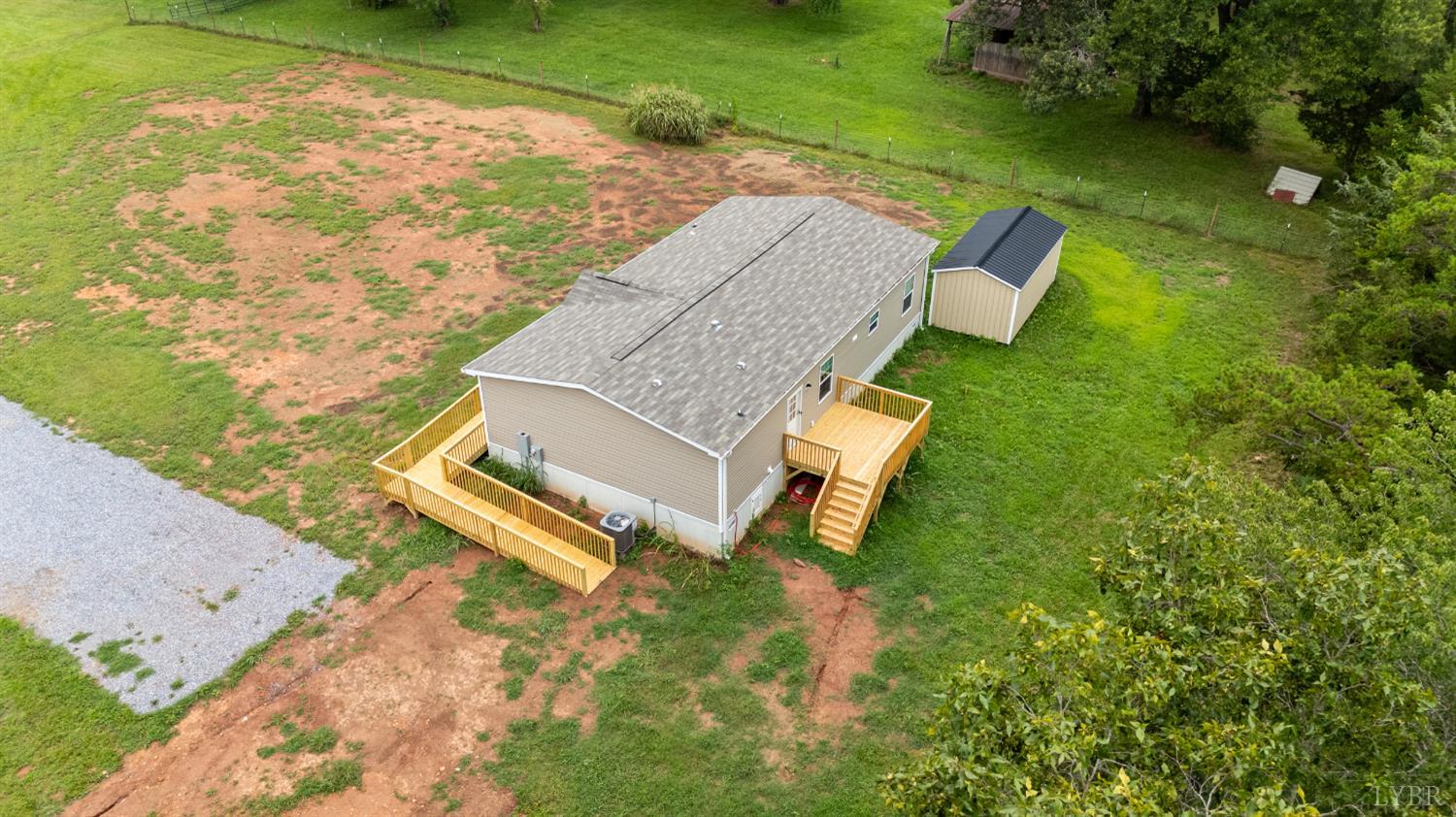 4526 Pigeon Run Road Gladys, VA 24554 - Photo 50 of 54 an aerial view of a house with a garden and lake view