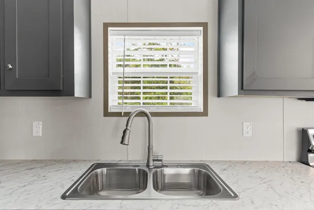 a kitchen with a sink and a window