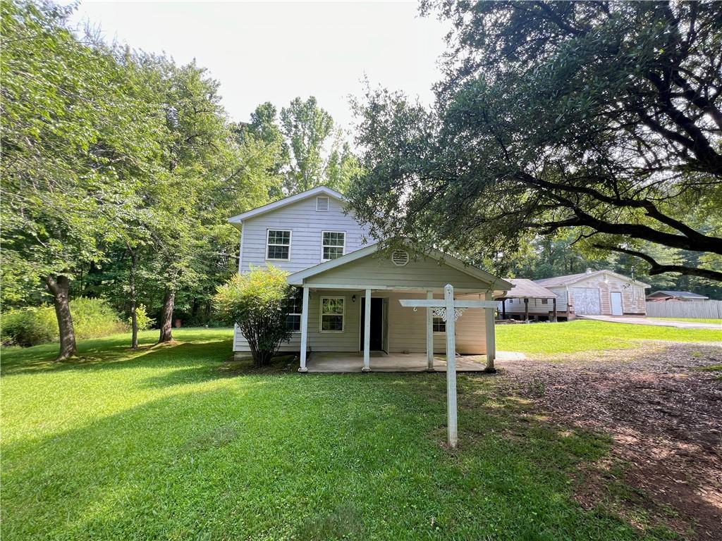 340 Womack Avenue Dallas, GA 30157 - Photo 2 of 29 a view of a house with a yard porch and sitting area