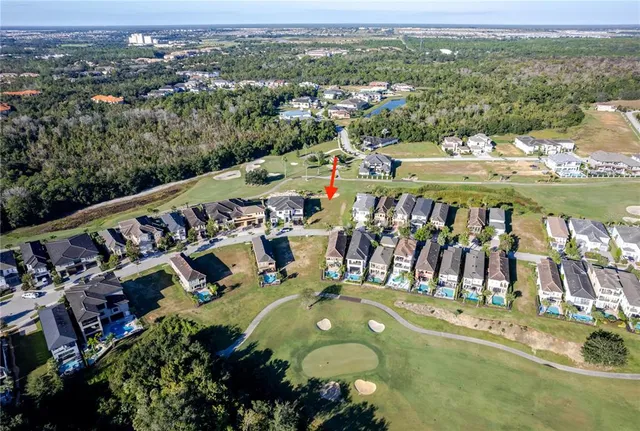 an aerial view of residential houses with outdoor space