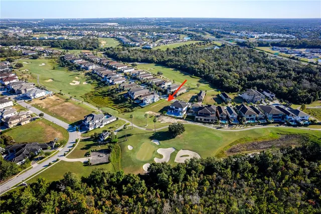an aerial view of a city with lots of residential buildings
