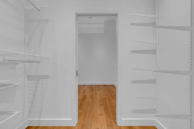 a view of a storage & utility room with a washer dryer