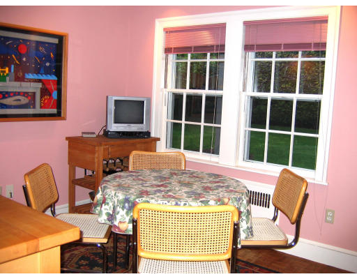 65 Wauwinet Road Newton, MA 02465 - Photo 6 of 12 a living room with furniture and a flat screen tv