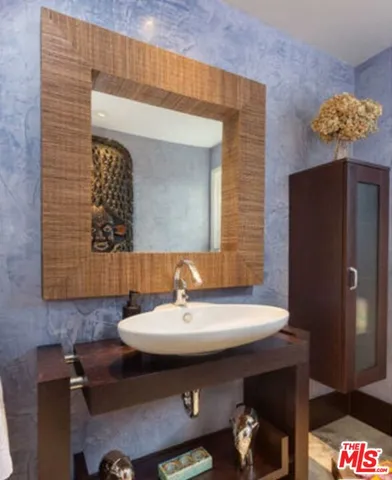 a backyard of a house with wooden floor and outdoor seating