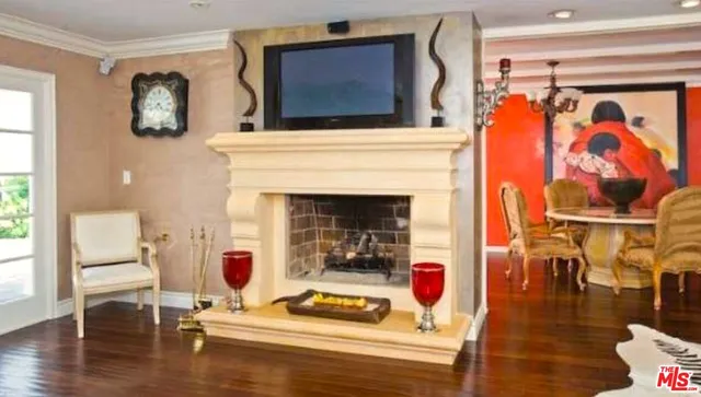a kitchen with stainless steel appliances granite countertop a stove a sink and white cabinets