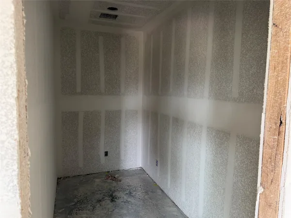 a view of a hallway with two rooms