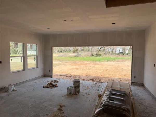 a view of a wooden door and a window
