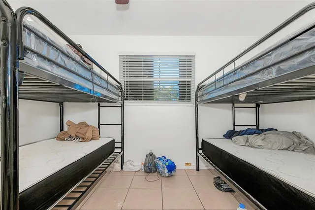 a room with gym equipment and a large window