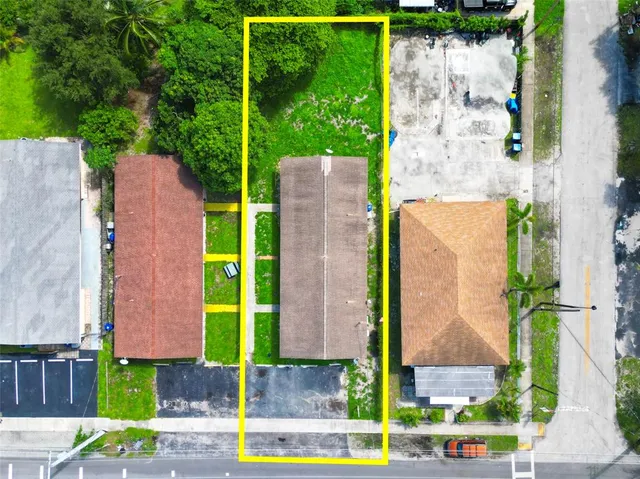 an aerial view of a houses with a outdoor space