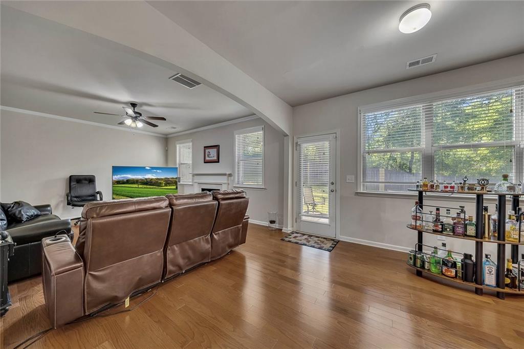 6204 Oakdale Ridge Court Southeast Mableton, GA 30126 - Photo 11 of 48 a living room with furniture and a flat screen tv
