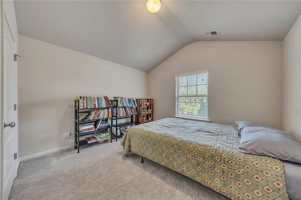 6204 Oakdale Ridge Court Southeast Mableton, GA 30126 - Photo 22 of 48 a bedroom with a bed and a window