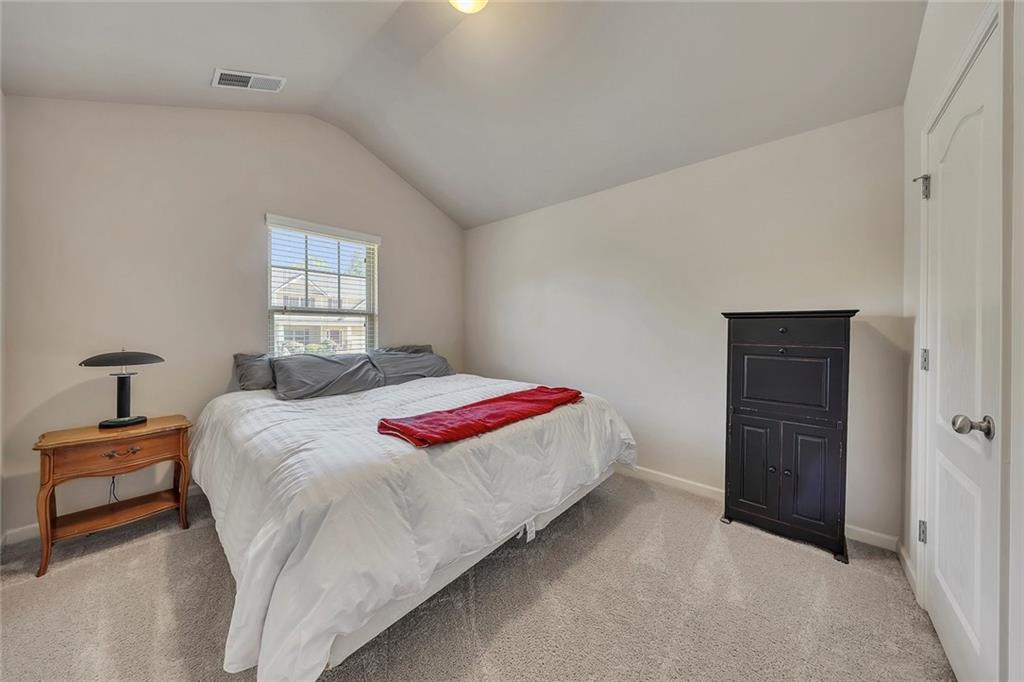 6204 Oakdale Ridge Court Southeast Mableton, GA 30126 - Photo 23 of 48 a bedroom with a bed and a window