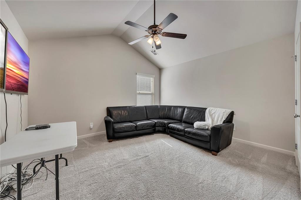 6204 Oakdale Ridge Court Southeast Mableton, GA 30126 - Photo 24 of 48 a living room with furniture and a ceiling fan
