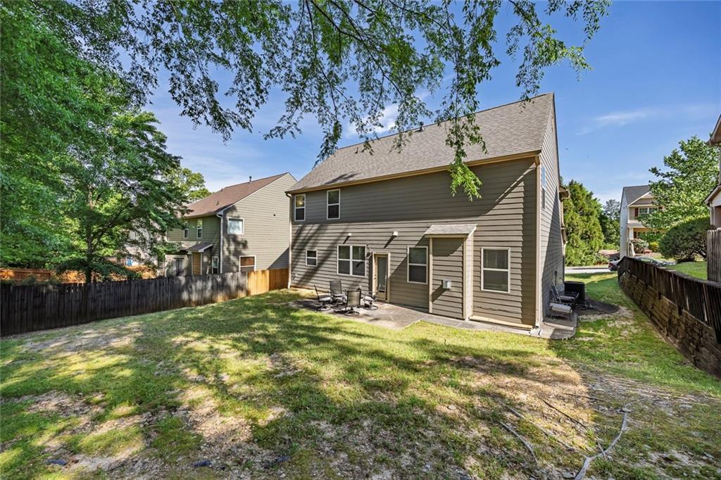 6204 Oakdale Ridge Court Southeast Mableton, GA 30126 - Photo 28 of 48 front view of a house with a yard