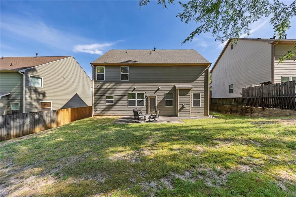 6204 Oakdale Ridge Court Southeast Mableton, GA 30126 - Photo 29 of 48 a view of a house with a yard