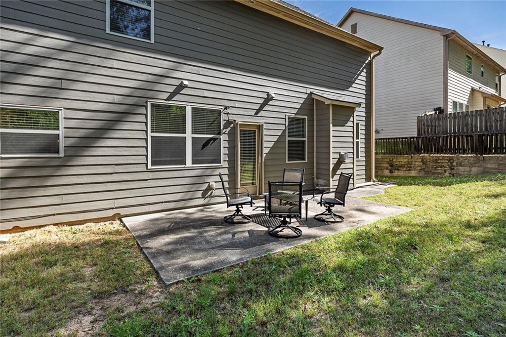 6204 Oakdale Ridge Court Southeast Mableton, GA 30126 - Photo 31 of 48 a view of a house with backyard and sitting area