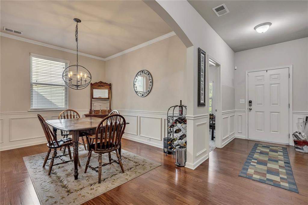 6204 Oakdale Ridge Court Southeast Mableton, GA 30126 - Photo 4 of 48 a view of a dining room with furniture window and wooden floor
