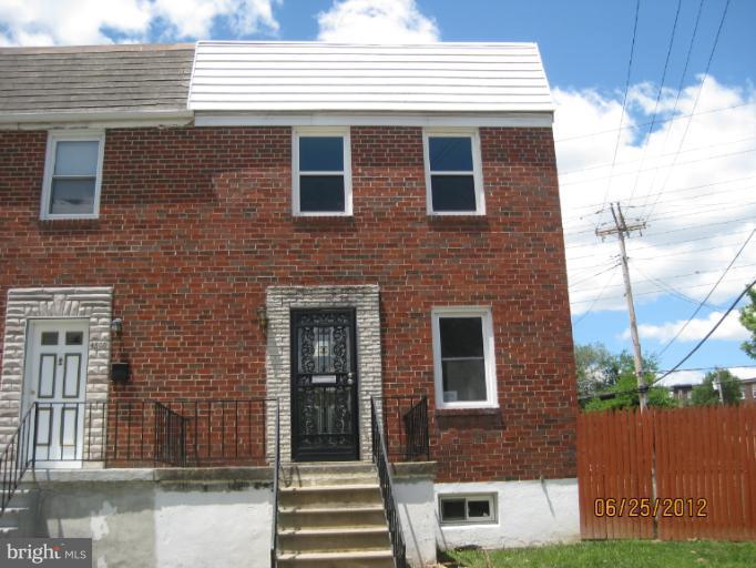 4810 Greencrest Road Baltimore, MD 21206 - Photo 1 of 14 a front view of a house with a yard