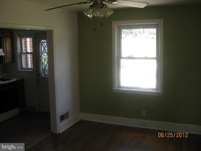 4810 Greencrest Road Baltimore, MD 21206 - Photo 5 of 14 a view of an empty room with a window