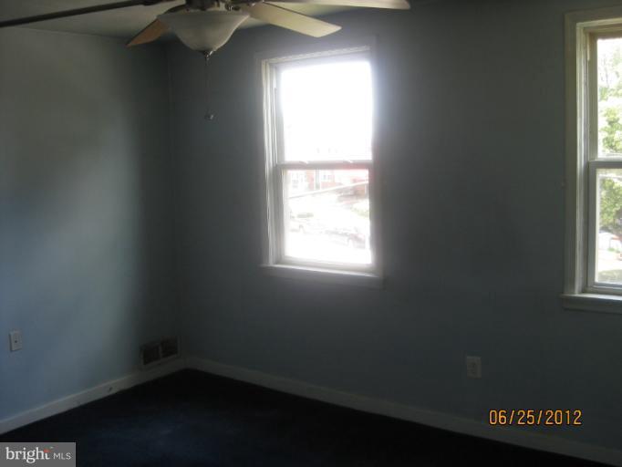 4810 Greencrest Road Baltimore, MD 21206 - Photo 8 of 14 an empty room with a window