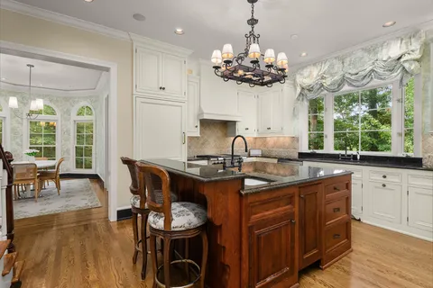 a kitchen with a refrigerator and a stove