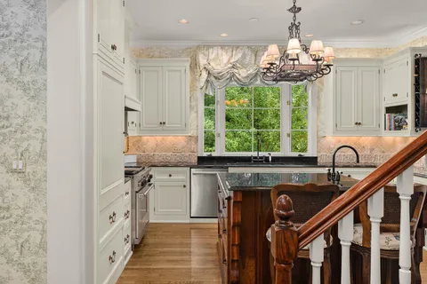 a living room with furniture and large windows