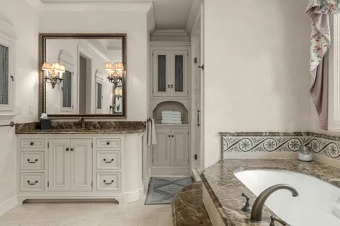 a bathroom with a sink and a mirror