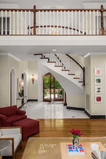 a living room with furniture fireplace and flat screen tv