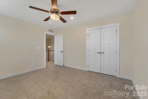 an empty room with fan