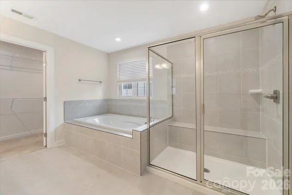 a bathroom with a shower and a sink