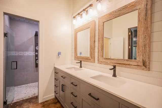 a bathroom with a sink and a mirror