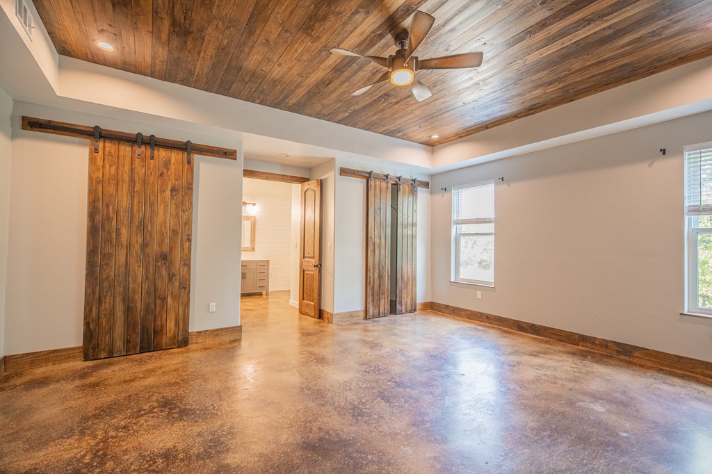 2181 Goat Creek Road Kerrville, TX 78028 - Photo 9 of 25 a view of an empty room with a window