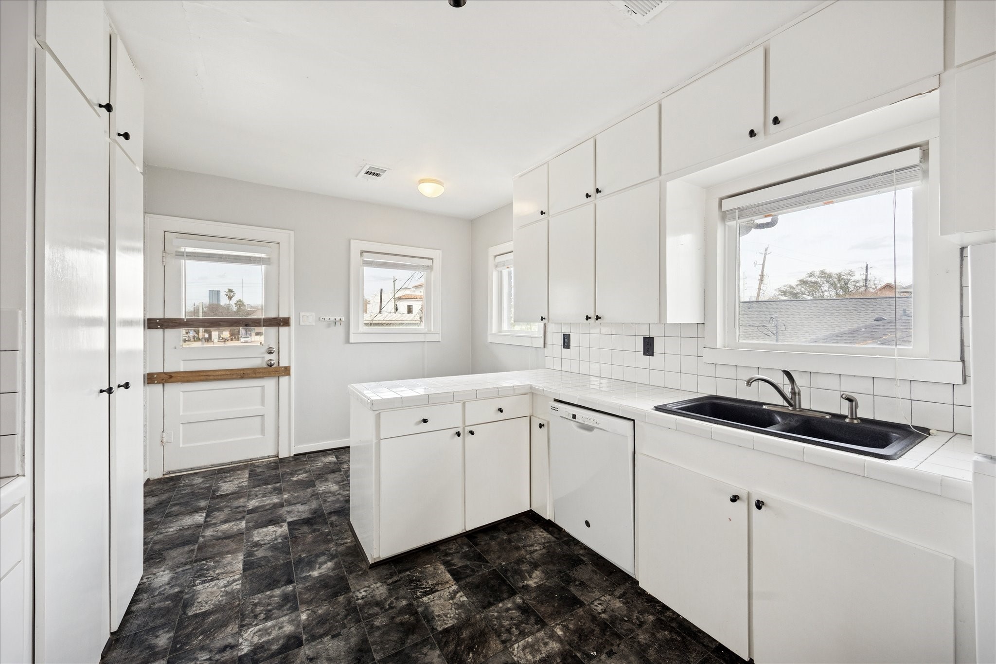 1758 Hawthorne Street Houston, TX 77098 - Photo 15 of 27 a kitchen with granite countertop a sink and cabinets