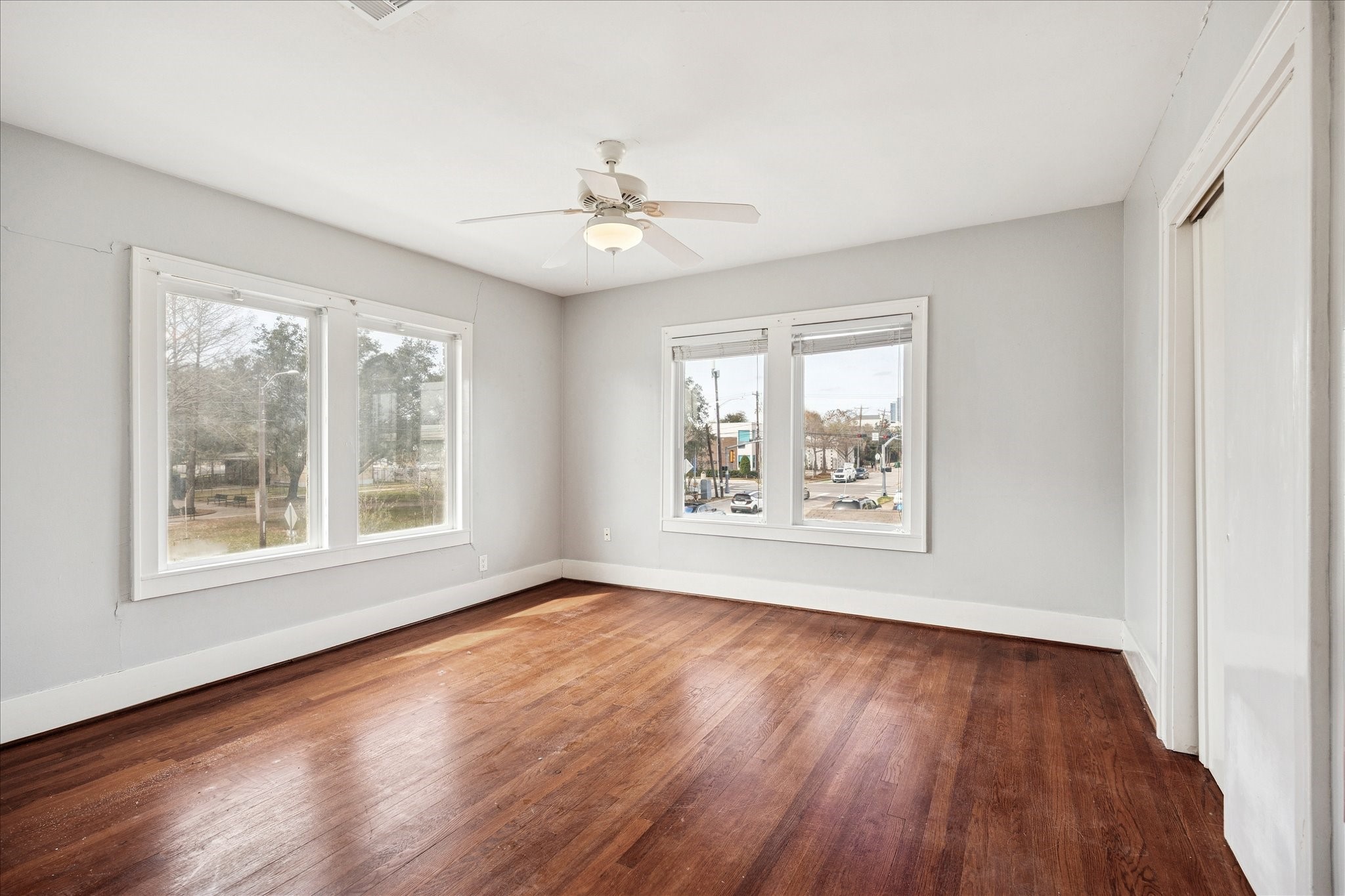 1758 Hawthorne Street Houston, TX 77098 - Photo 17 of 27 a view of an empty room with wooden floor and a window