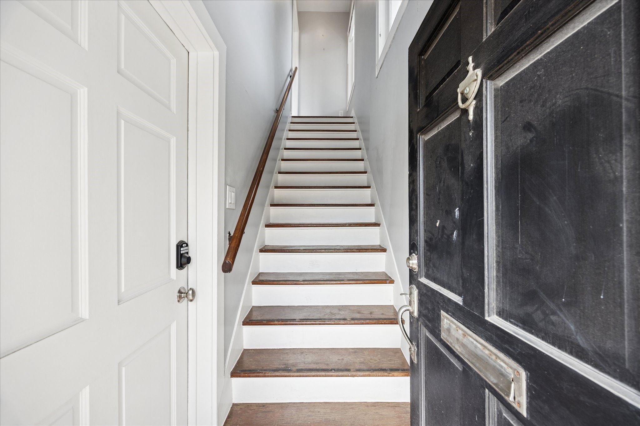 1758 Hawthorne Street Houston, TX 77098 - Photo 2 of 27 a view of staircase with white walls and white door