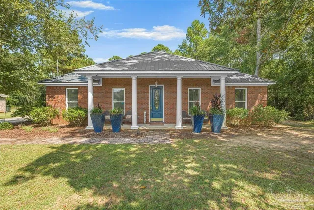 a view of a house with a garden