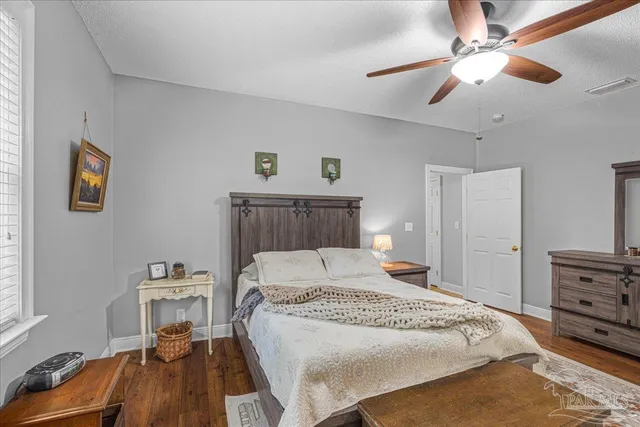 a bed room with a bed and a chandelier