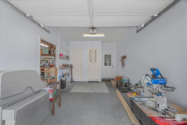 a workspace with furniture and a flat screen tv
