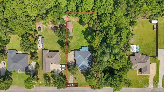 an aerial view of residential houses and outdoor space