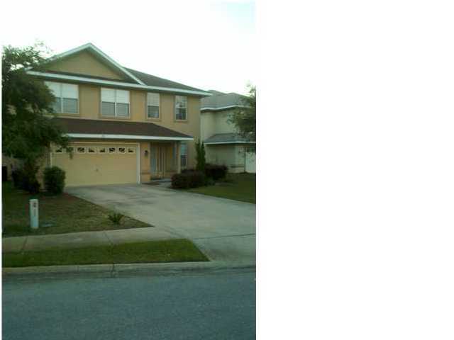 98 Red Maple Court Santa Rosa Beach, FL 32459 - Photo 2 of 3 a front view of a house with a yard