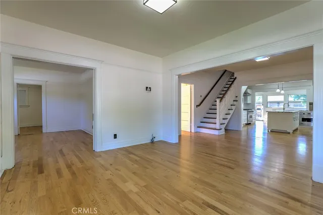 a view of an entryway with wooden floor and a window
