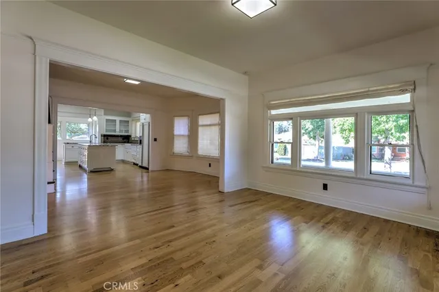 a kitchen with granite countertop a sink a counter top space and stainless steel appliances