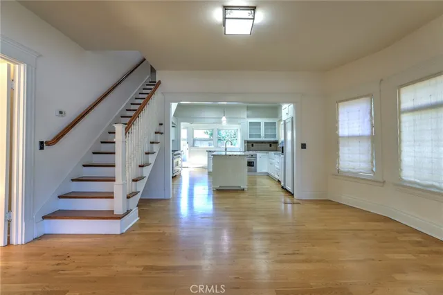 a kitchen with granite countertop a sink stove and cabinets