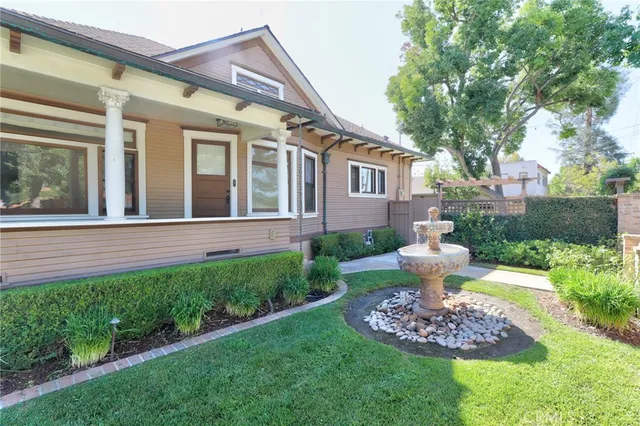 a front view of a house with a yard garage and outdoor seating