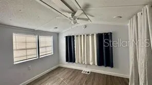 an entryway with a window and a livingroom