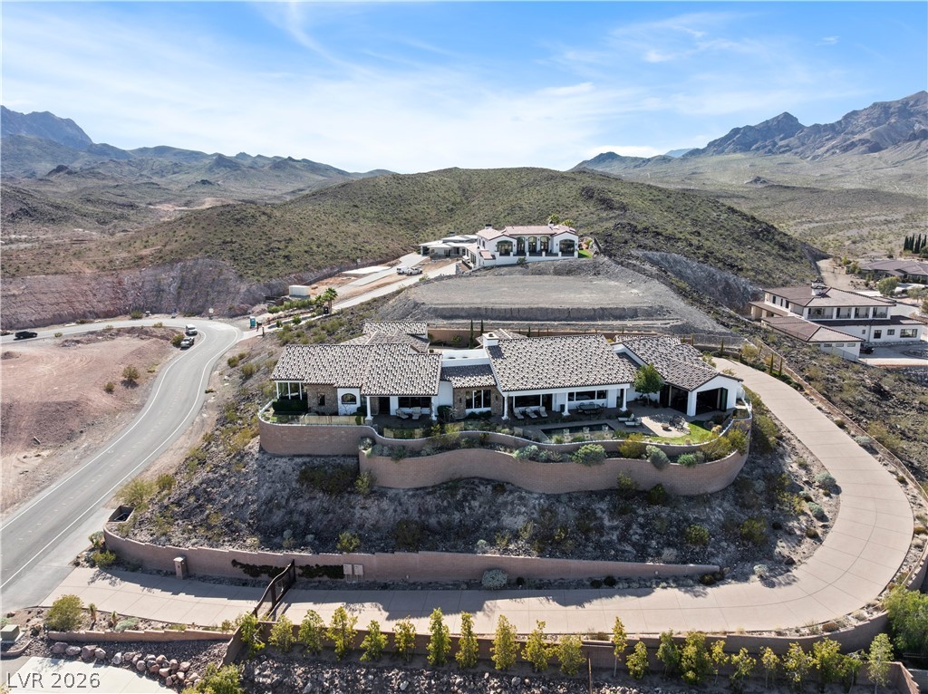1123 Christian Road Henderson, NV 89002 - Photo 82 of 94 Perched on a mountainside, this expansive desert residence offers panoramic views and a serene landscape.