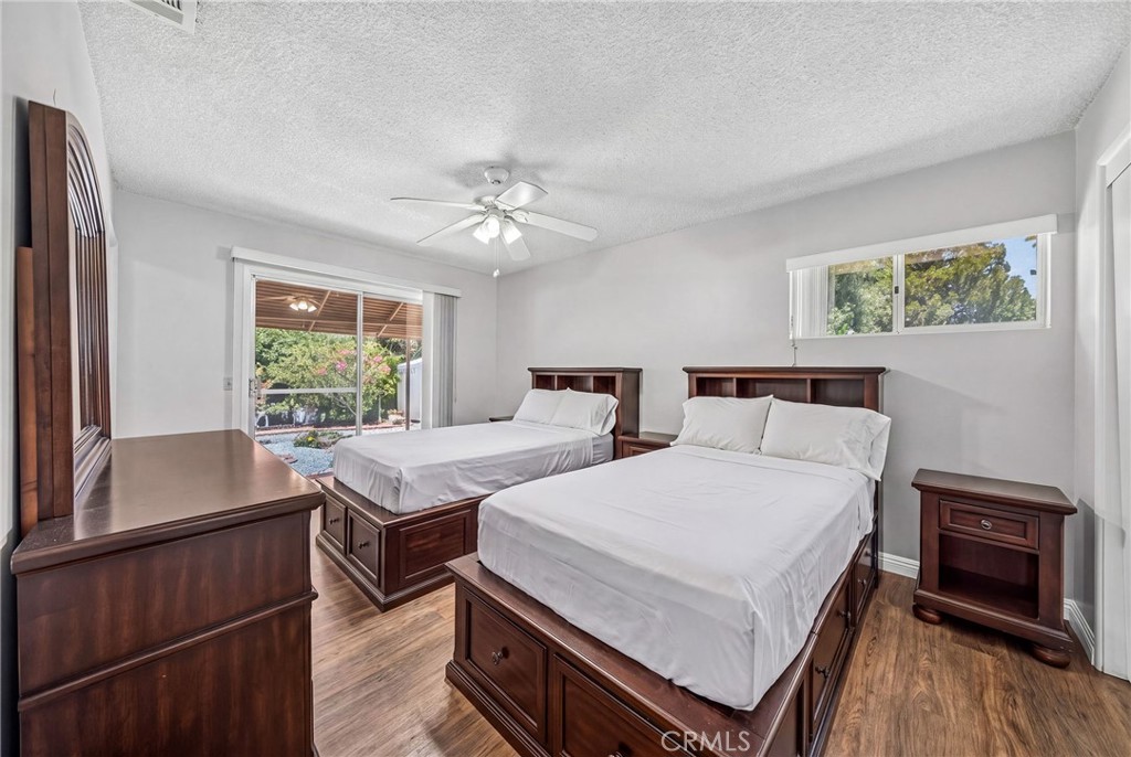 29078 Bradley Road Menifee, CA 92586 - Photo 24 of 42 a bedroom with a bed and a window